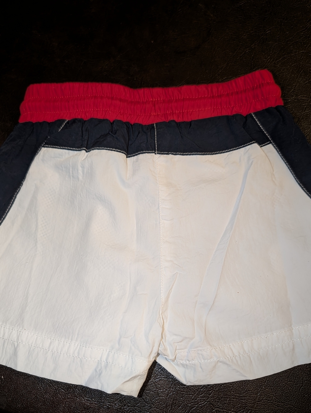 KITH Kids colorblock swim trunks in red, blue, & white w/ embroidered KITH logo - Picture 2 of 3